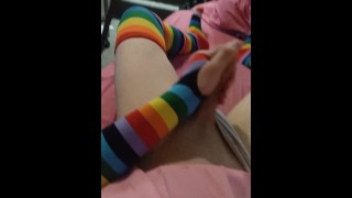 Weak femboy in pink schoolgirl uniform and rainbow gloves & stockings cums
